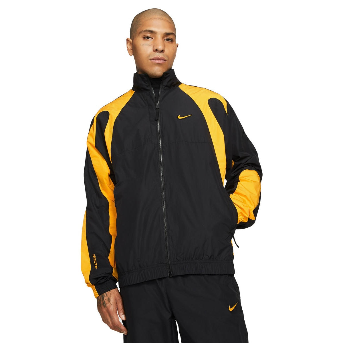 Conjunto Nike x NOCTA Woven Track Preto/Amarelo